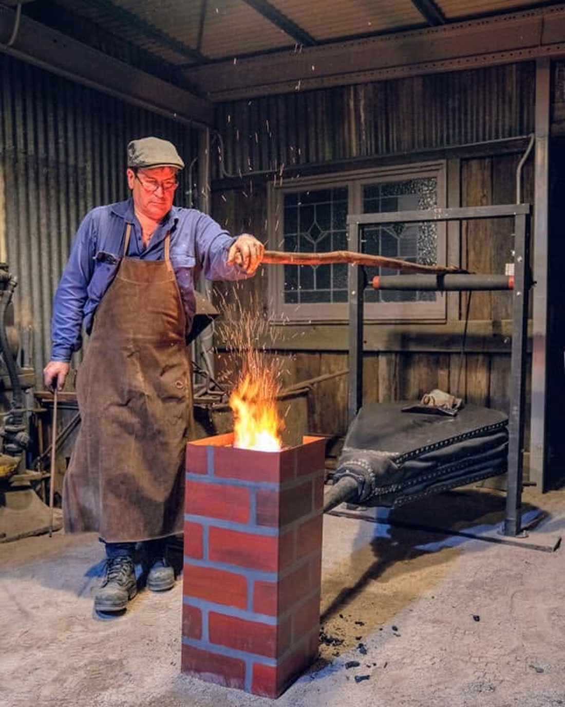 Martin at the brick forge, sparks rising